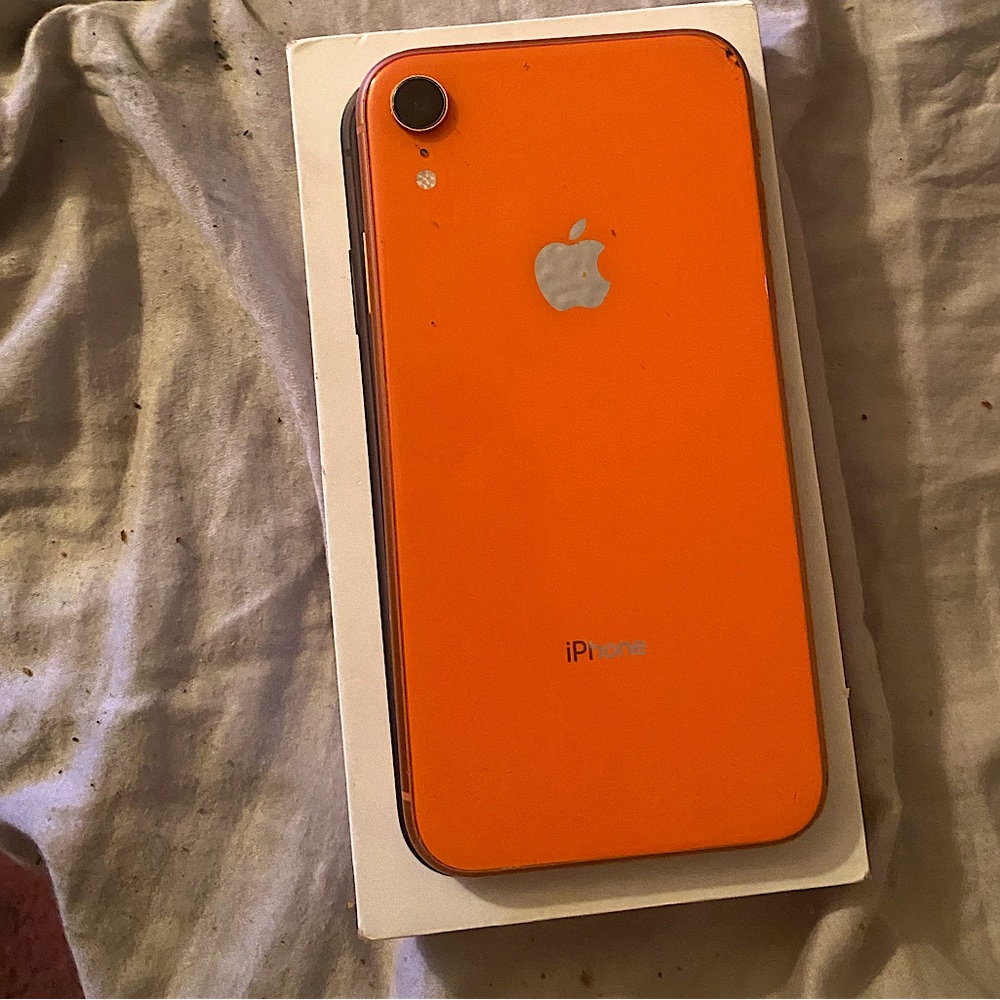 iPhone XR Used once/Basically New . Phone is UNLOCKED and charger included